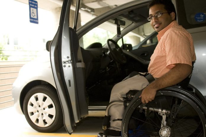 16401-a-disabled-man-in-a-wheelchair-getting-out-of-a-car-pv